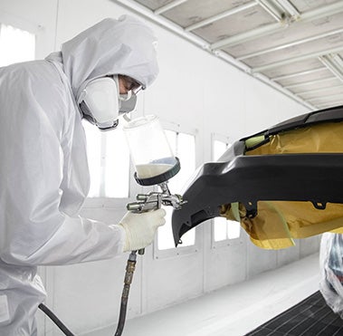 Collision Center Technician Painting a Vehicle | LeadCar Toyota Mankato in MANKATO MN